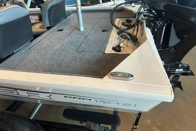 Slide: The Image of 2026 Tracker Pro 170 boat interior with motor and seating. - 5