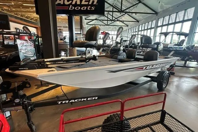 The Image of 2026 Tracker Pro 170 boat displayed in showroom, featuring sleek design and modern amenities. - 0