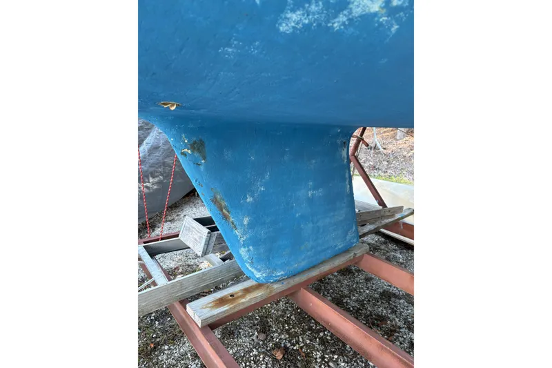 Slide: The Image of Blue keel of a 1981 Catalina 22 sailboat on a trailer. - 17