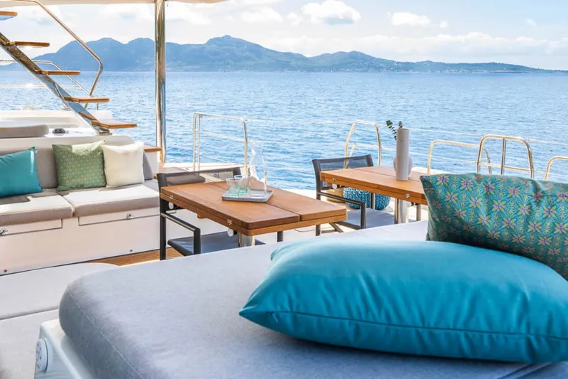 Slide: The Image of Luxurious Lagoon 60 yacht interior with ocean view, featuring elegant seating and decor, 2026 model. - 14