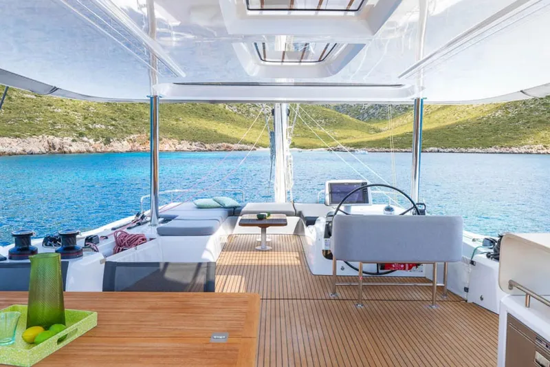 Slide: The Image of Luxurious 2026 Lagoon 60 yacht interior with scenic ocean view and modern amenities. - 19