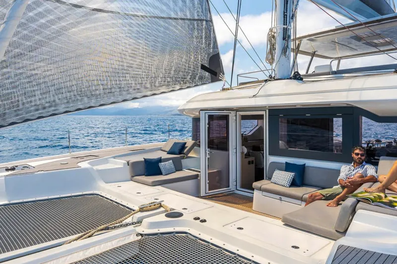 Slide: The Image of Luxurious 2026 Lagoon 60 yacht with spacious deck and comfortable seating. - 21