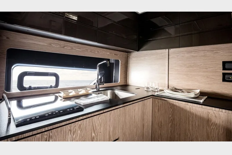 Slide: The Image of 2016 Azimut Atlantis 43 yacht docked, featuring sleek design and vibrant orange seating. - 11