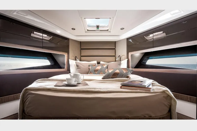 Slide: The Image of 2016 Azimut Atlantis 43 yacht with vibrant orange seating and sleek design. - 12