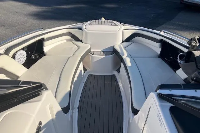 Slide: The Image of 2016 Yamaha Boats AR240 interior with spacious seating and sleek design. - 5