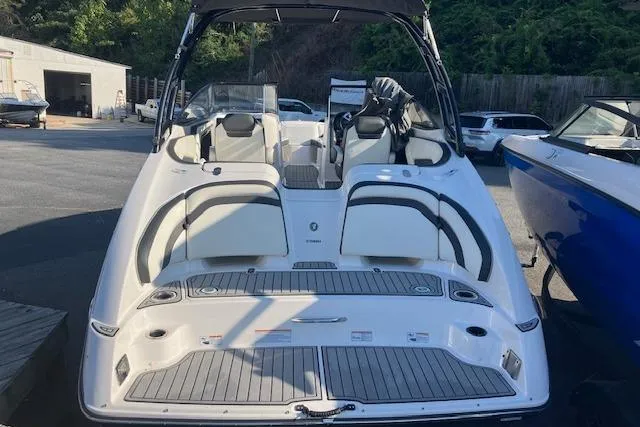 Slide: The Image of 2016 Yamaha Boats AR240, sleek white design, spacious seating, docked outdoors. - 7