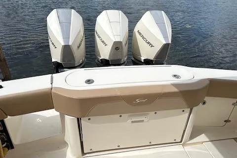 Slide: The Image of 2019 Scout 355 LXF boat with triple Mercury outboard engines on water. - 44