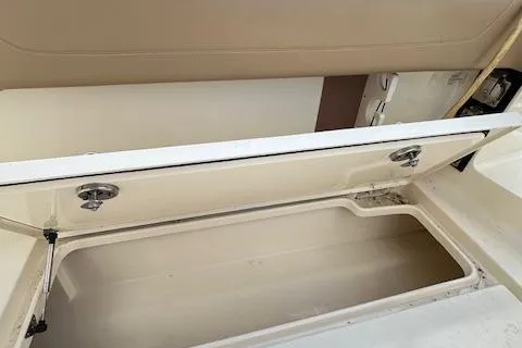 Slide: The Image of Open storage compartment on a 2019 Scout 355 LXF boat. - 49
