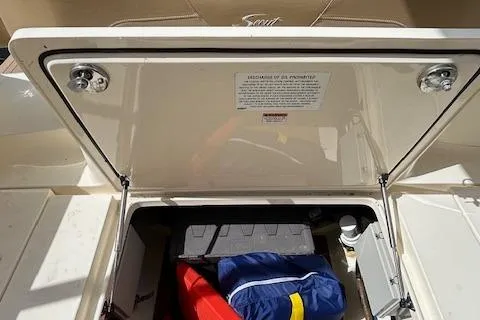 Slide: The Image of 2019 Scout 355 LXF storage compartment with safety equipment and gear. - 50