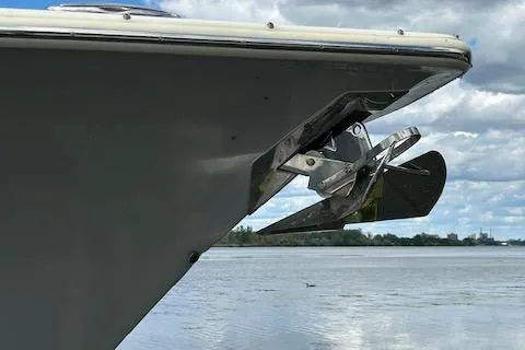 Slide: The Image of 2019 Scout 355 LXF boat anchor against a serene water backdrop. - 51