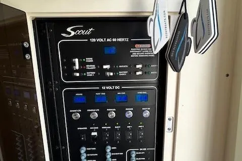 Slide: The Image of Control panel of 2019 Scout 355 LXF boat with hanging air fresheners. - 57