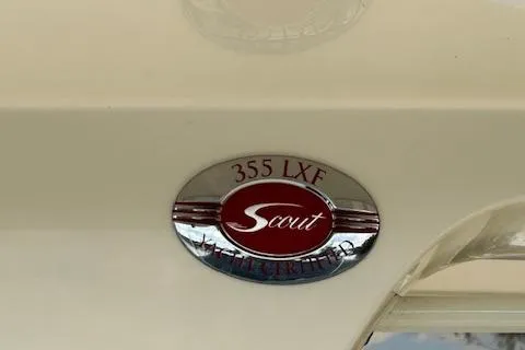 Slide: The Image of 2019 Scout 355 LXF logo on boat exterior. - 58