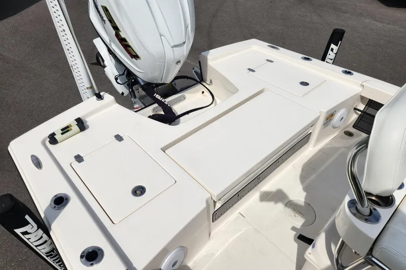 Slide: The Image of 2024 Pathfinder 2200 TRS boat deck with motor and seating area. - 15