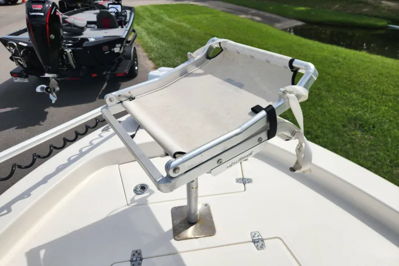 Slide: The Image of 2024 Pathfinder 2200 TRS boat with a mounted seat on deck. - 9