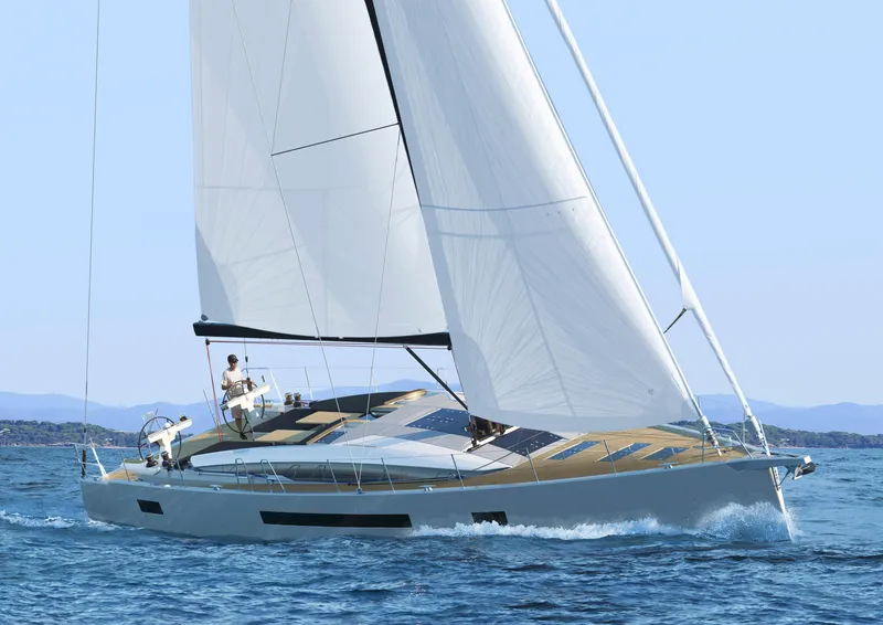 Slide: The Image of 2026 Jeanneau 65 yacht sailing on open water, showcasing sleek design and performance. - 12