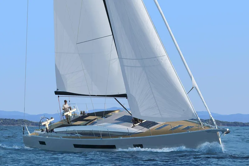 Slide: The Image of 2026 Jeanneau 65 yacht sailing on open water, showcasing sleek design and spacious deck. - 8