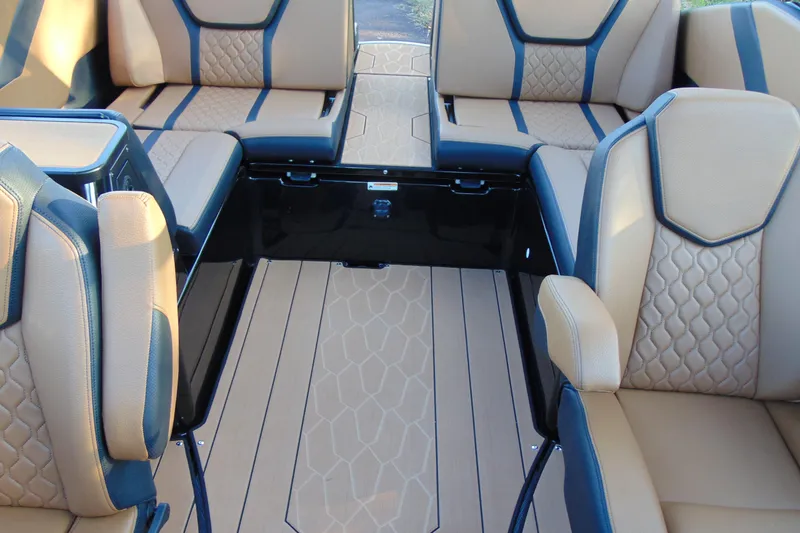 Slide: The Image of 2026 Yamaha Boats 255XD interior with tan and blue seating, modern design. - 16