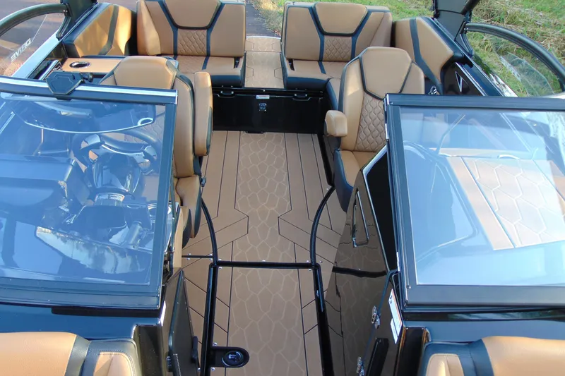 Slide: The Image of 2026 Yamaha Boats 255XD interior with tan seating and modern design. - 19