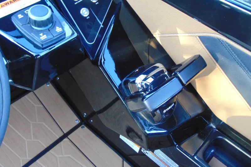 Slide: The Image of 2026 Yamaha Boats 255XD control panel with sleek black and tan design. - 22
