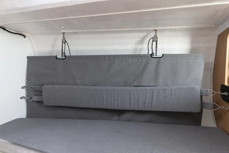 Slide: The Image of Interior view of 2026 Jeanneau Sun Fast 3300 sailboat with gray cushioned seating. - 10