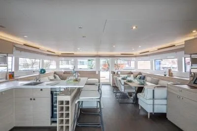 Slide: The Image of Luxurious interior of 2026 Lagoon 60 yacht with modern kitchen and dining area. - 3