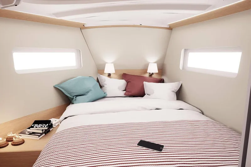 Slide: The Image of Cozy cabin interior of 2026 Jeanneau Sun Odyssey 380 yacht with modern bedding and soft lighting. - 11