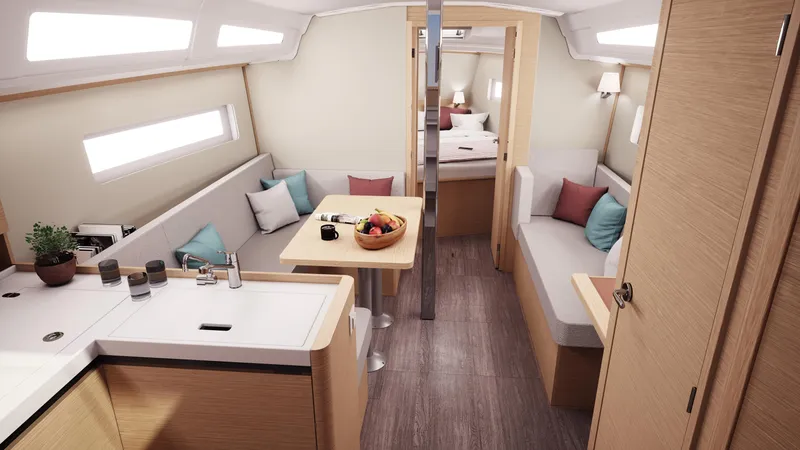 Slide: The Image of 2026 Jeanneau Sun Odyssey 380 interior with modern kitchen, cozy seating, and elegant design. - 13