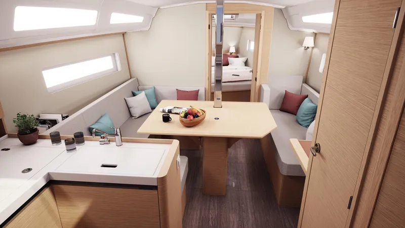 Slide: The Image of Interior of 2026 Jeanneau Sun Odyssey 380 yacht, featuring modern dining and kitchen area. - 14