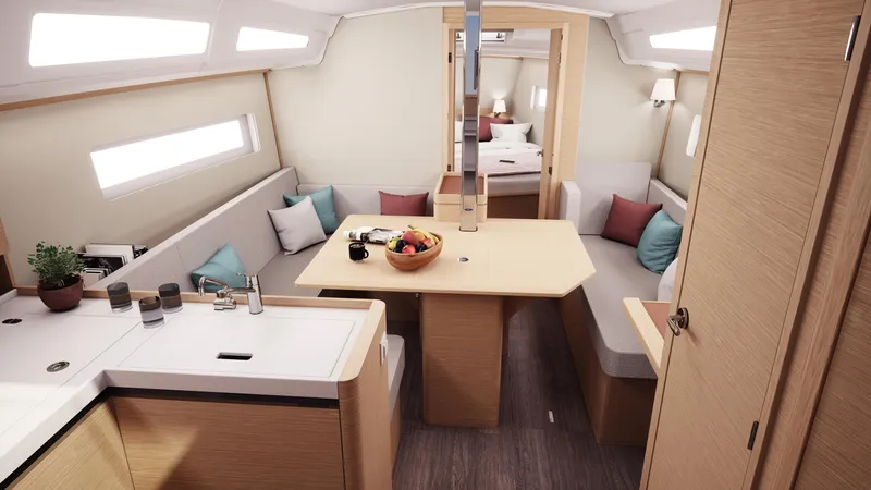 Slide: The Image of 2026 Jeanneau Sun Odyssey 380 interior with modern kitchen and cozy seating area. - 15