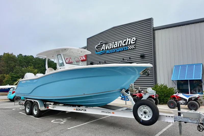 The Image of 2026 Sea Fox 288 Commander boat on trailer at Avalanche Motorsports dealership. - 1