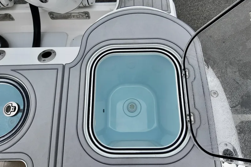 Slide: The Image of Livewell compartment on 2026 Sea Fox 288 Commander boat, open lid view. - 11