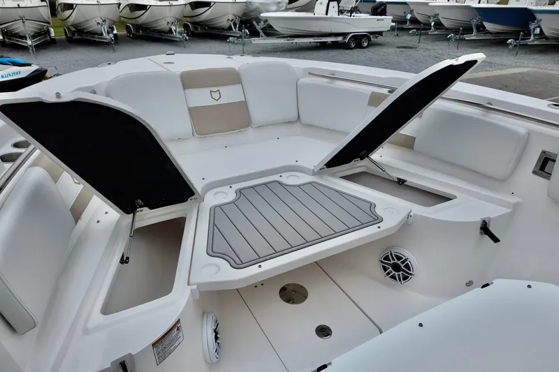 Slide: The Image of 2026 Sea Fox 288 Commander boat interior with open storage compartments and seating. - 15