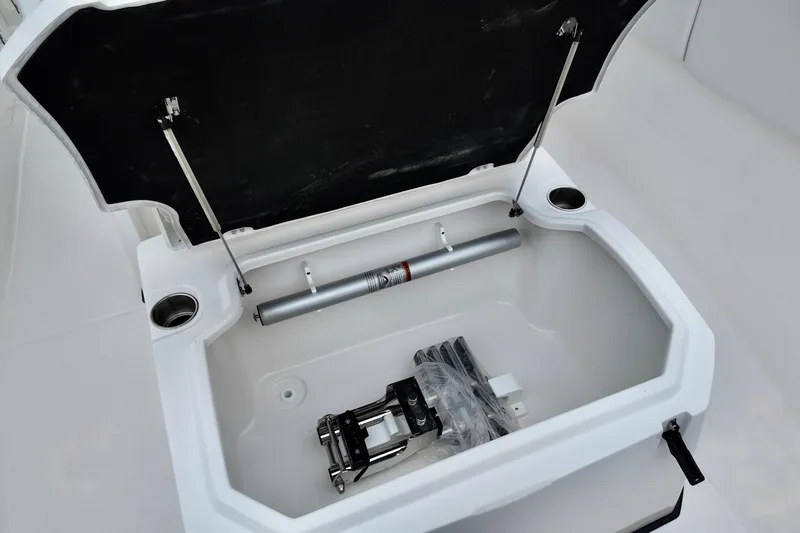 Slide: The Image of Open storage compartment in 2026 Sea Fox 288 Commander boat, featuring hydraulic components. - 16