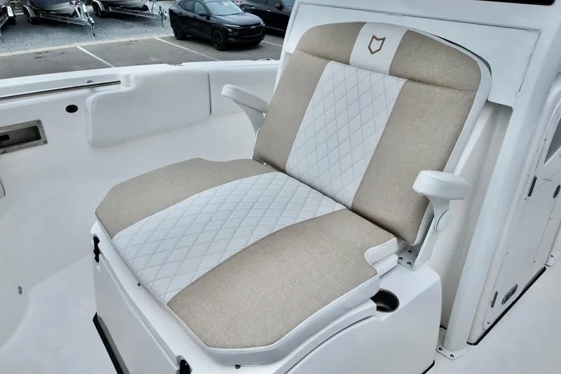 Slide: The Image of 2026 Sea Fox 288 Commander boat seat with beige and white upholstery, featuring diamond stitching. - 20