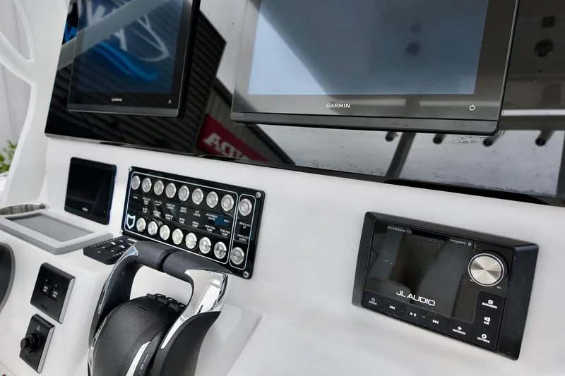 Slide: The Image of 2026 Sea Fox 288 Commander dashboard with Garmin displays and JL Audio system. - 22