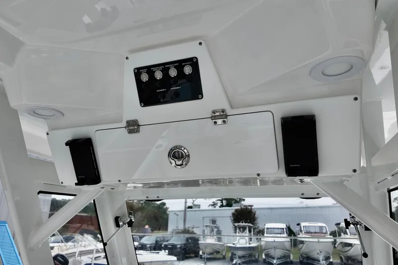 Slide: The Image of 2026 Sea Fox 288 Commander boat console with control panel and storage compartment. - 24