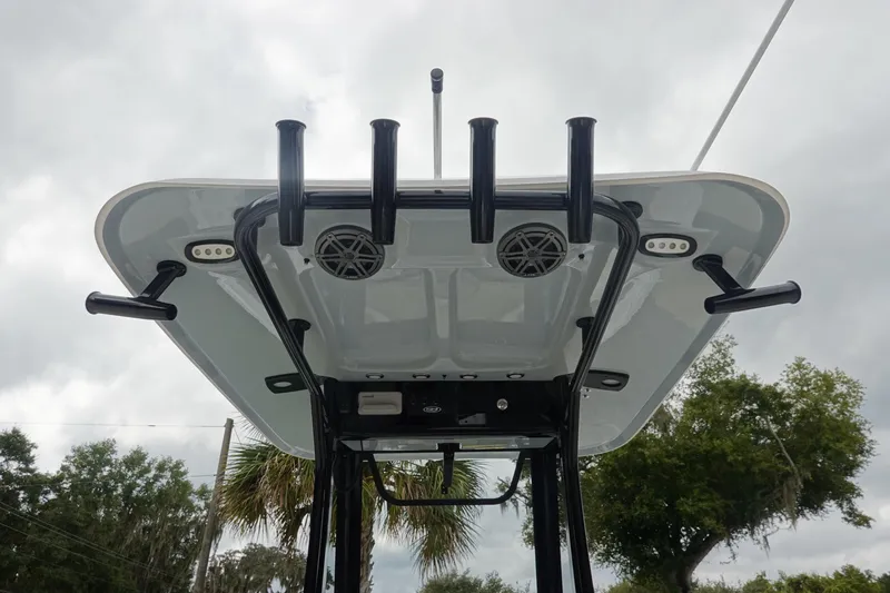 Slide: The Image of 2026 Sea Hunt Ultra 245 SE boat T-top with rod holders and speakers. - 12