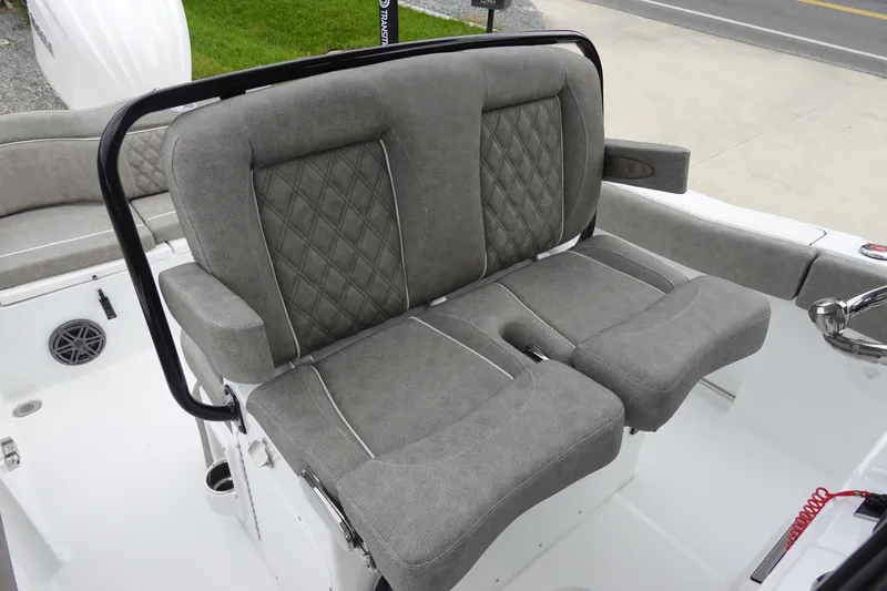 Slide: The Image of 2026 Sea Hunt Ultra 245 SE boat with gray cushioned seating and diamond stitching. - 14