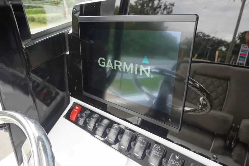 Slide: The Image of Garmin display on 2026 Sea Hunt Ultra 245 SE boat dashboard. - 16