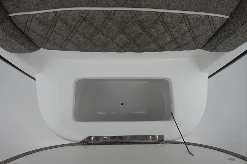 Slide: The Image of 2026 Sea Hunt Ultra 245 SE boat interior with cushioned seating and storage compartment. - 21