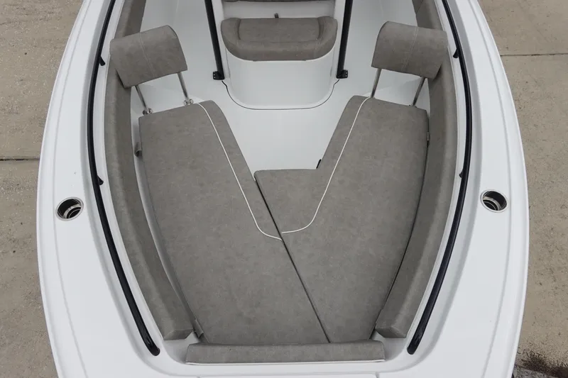 Slide: The Image of 2026 Sea Hunt Ultra 245 SE boat interior with gray cushioned seating. - 23