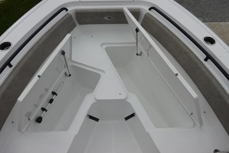 Slide: The Image of 2026 Sea Hunt Ultra 245 SE boat storage compartments open, showcasing spacious interior design. - 25