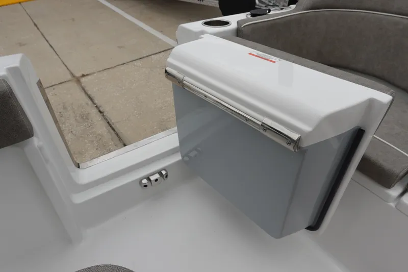 Slide: The Image of 2026 Sea Hunt Ultra 245 SE boat interior with seating and storage compartment. - 31