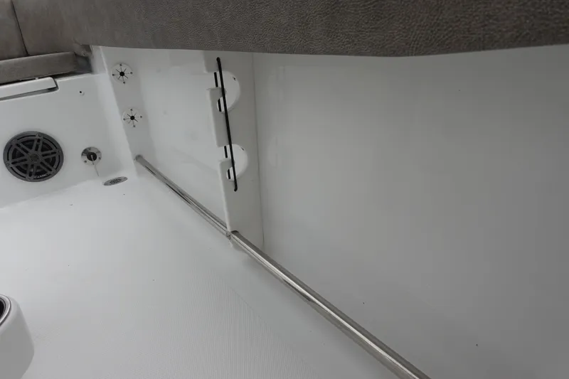 Slide: The Image of Interior view of 2026 Sea Hunt Ultra 245 SE boat, featuring seating and speaker. - 32