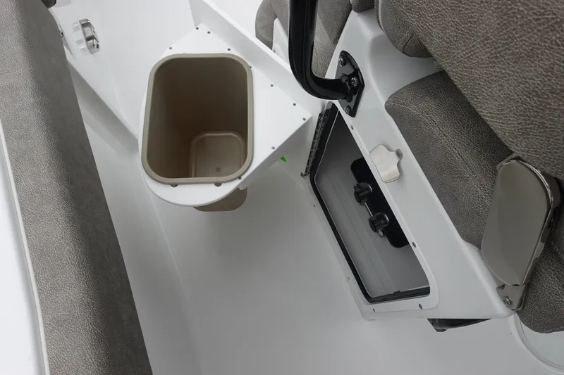 Slide: The Image of Interior of 2026 Sea Hunt Ultra 245 SE boat, featuring seating and storage compartments. - 34