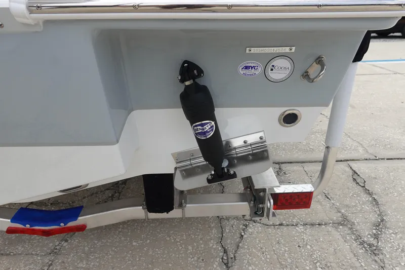 Slide: The Image of Rear view of 2026 Sea Hunt Ultra 245 SE boat with trailer and trim tab. - 7