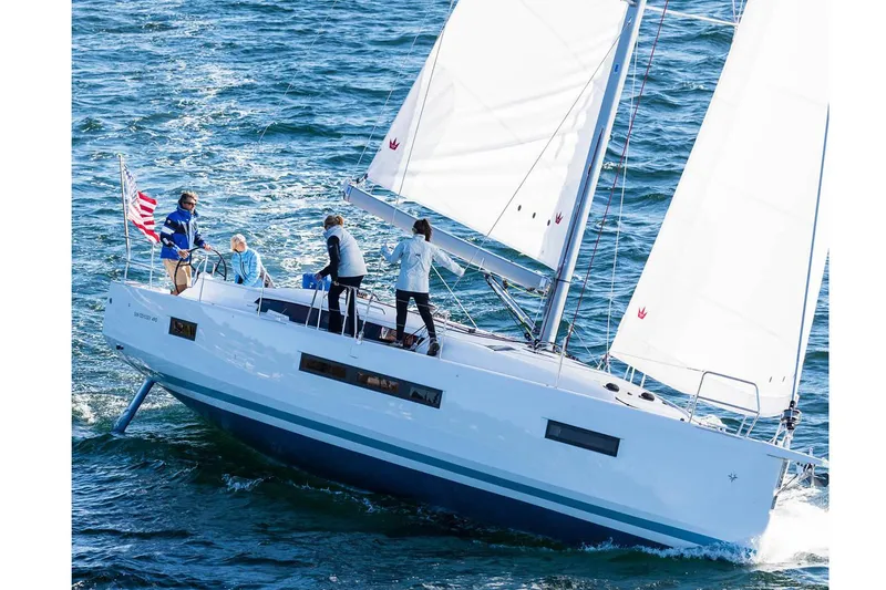 The Image of 2026 Jeanneau Sun Odyssey 490 sailing on open water with crew onboard. - 0