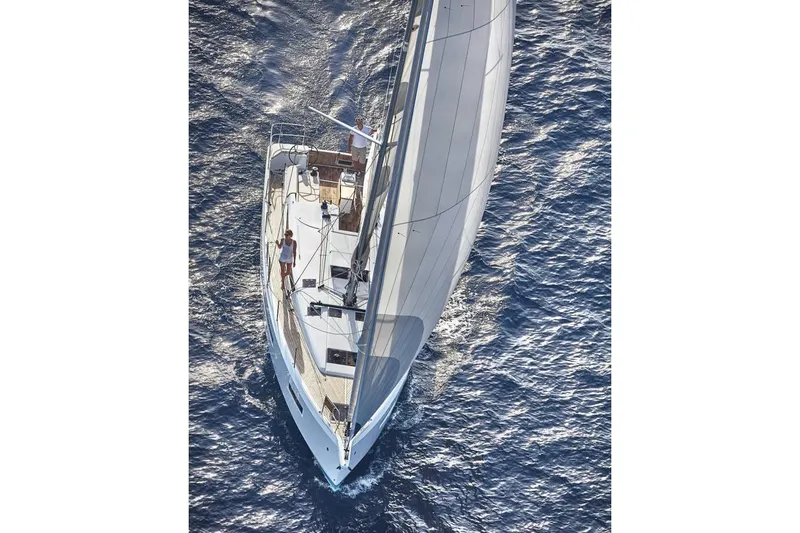 Slide: The Image of 2026 Jeanneau Sun Odyssey 490 sailing on open water, aerial view. - 11