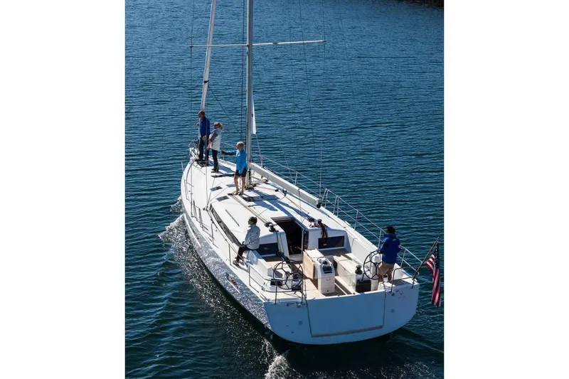 Slide: The Image of 2026 Jeanneau Sun Odyssey 490 sailing on calm blue waters. - 12