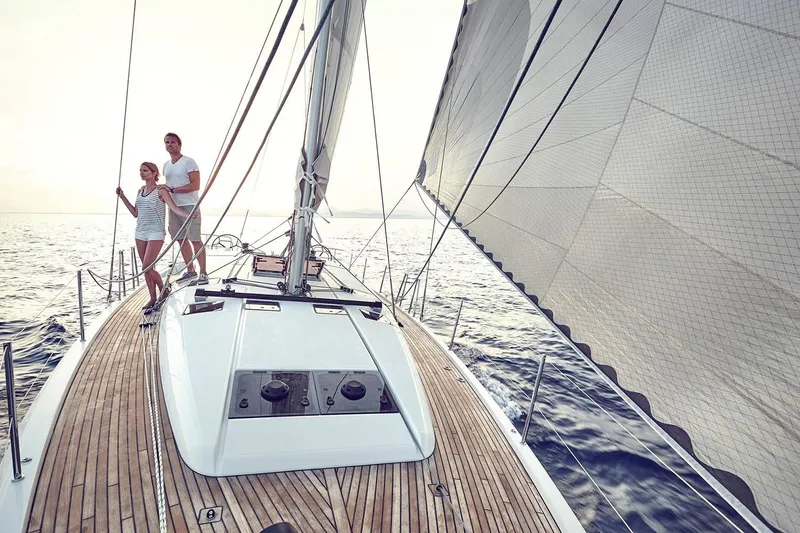 Slide: The Image of Couple sailing on Jeanneau Sun Odyssey 490 yacht, 2026 model, on open sea. - 13